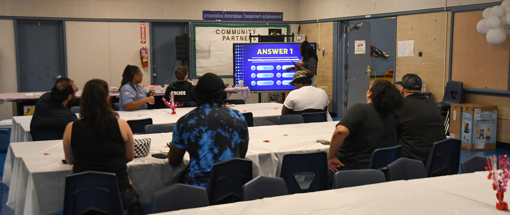 families playing game at game night