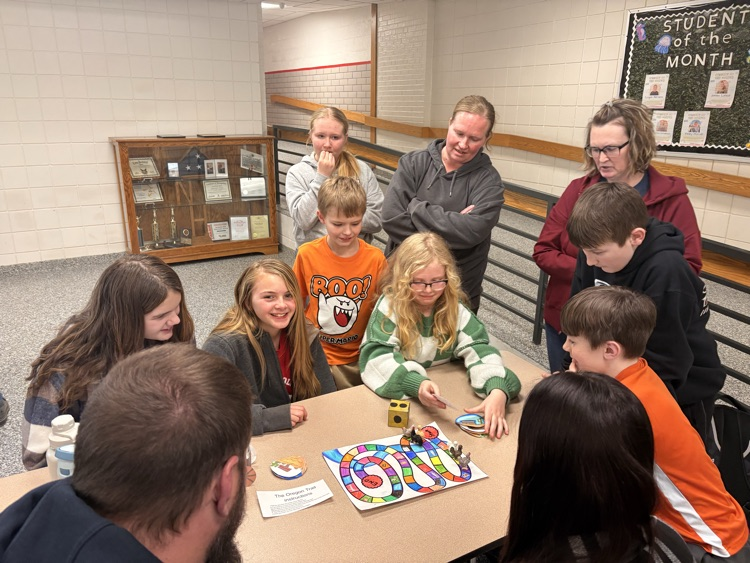 students and their families playing games