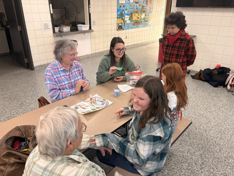 students and their families playing games
