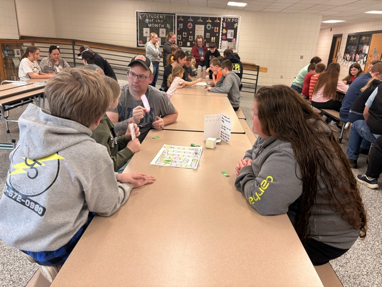 students and their families playing games
