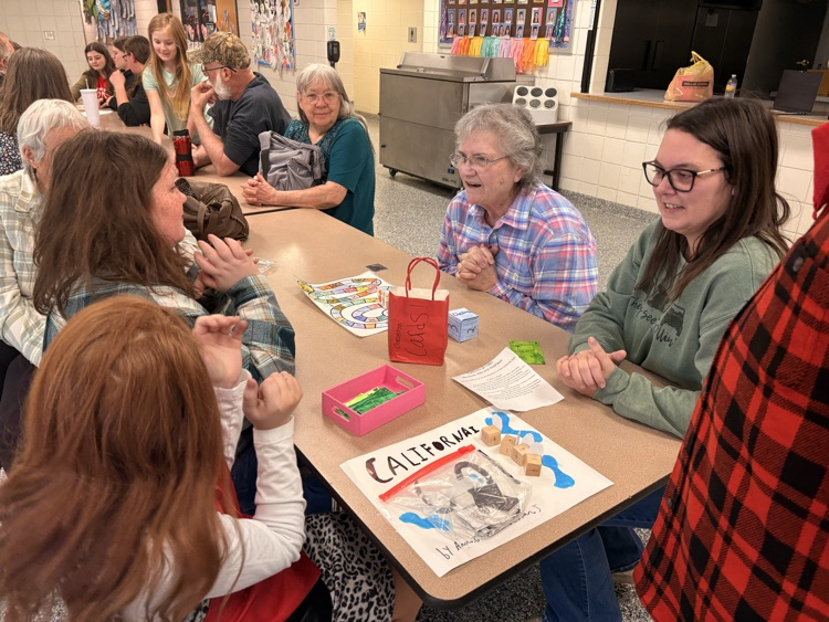 students and their families playing games