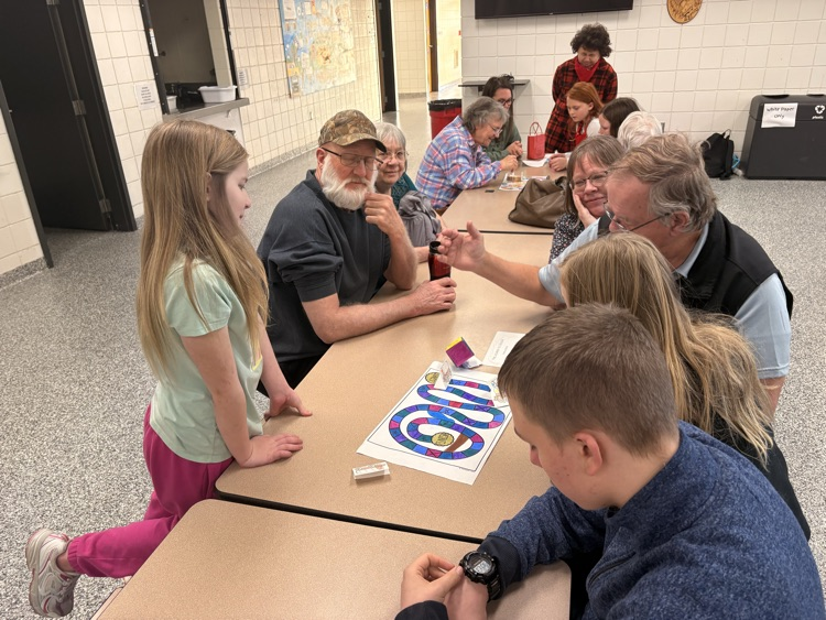 students and their families playing games