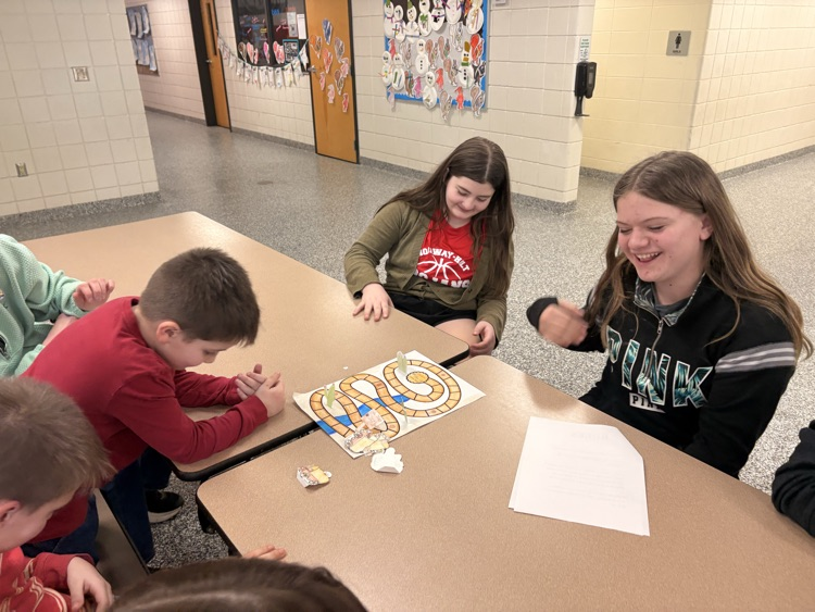 students and their families playing games