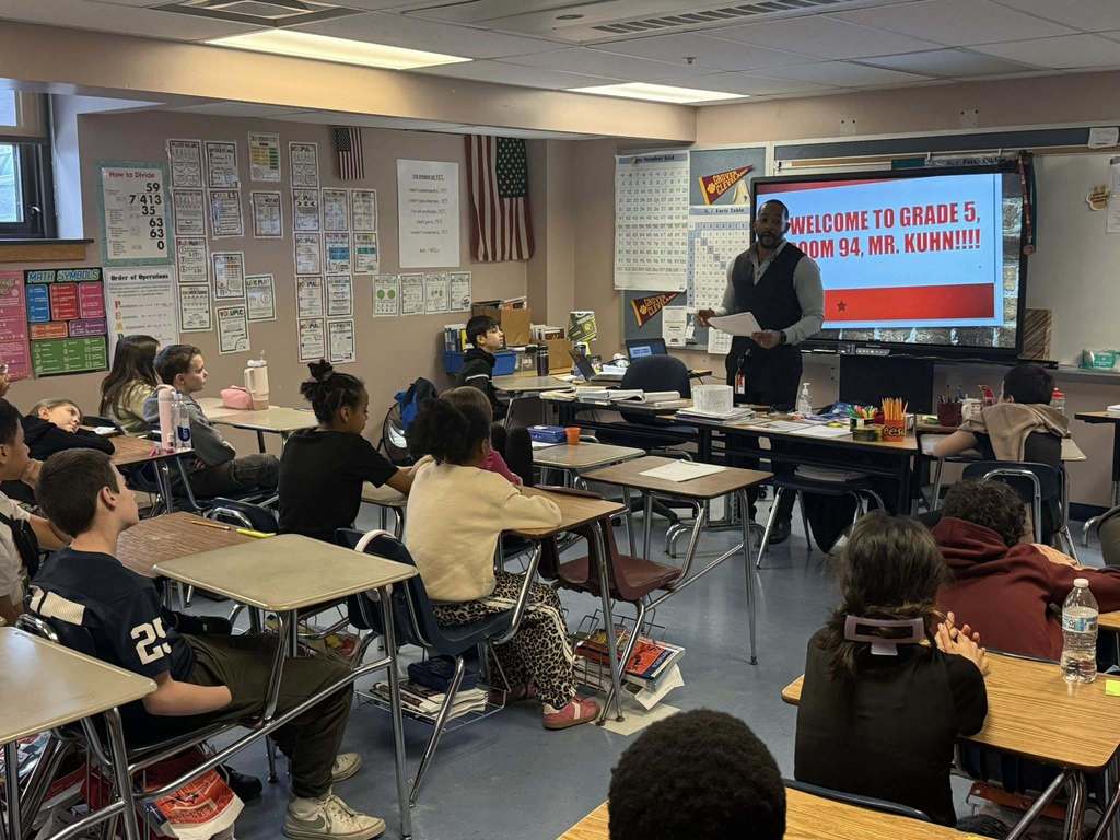 A speaker talking to a classroom.