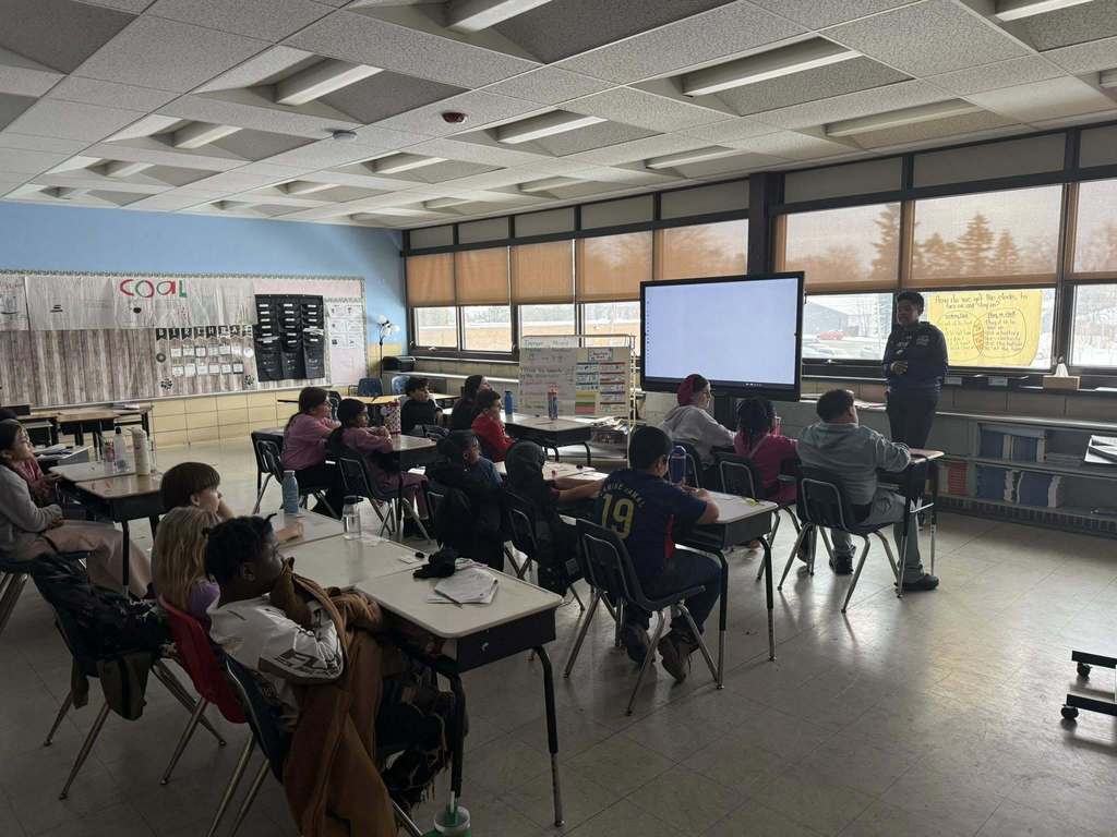 A speaker talking to a classroom.