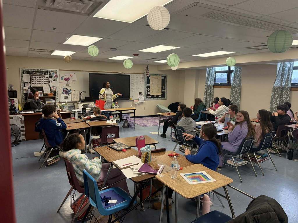 A speaker talking to a classroom.