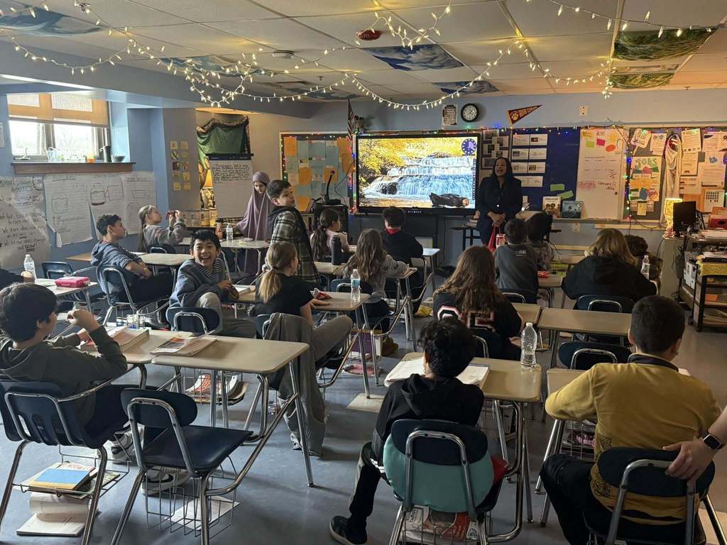 A speaker talking to a classroom.