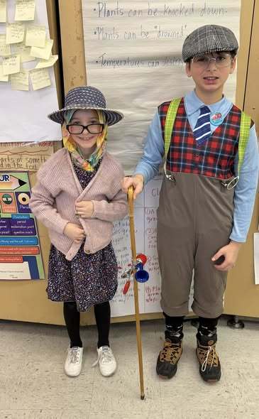 Two kids dressed as old people.