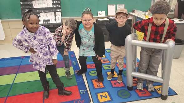 A group of kids dressed up as old people.