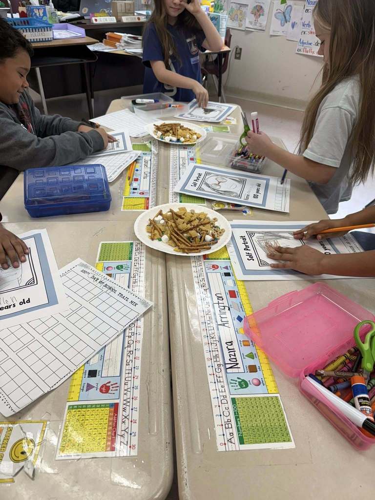 Kids taking snacks and putting them on a paper for a project.