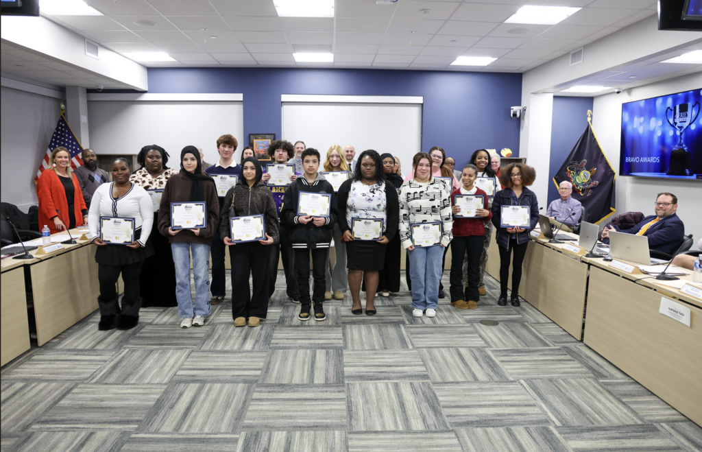 Group of students holding their certificates.