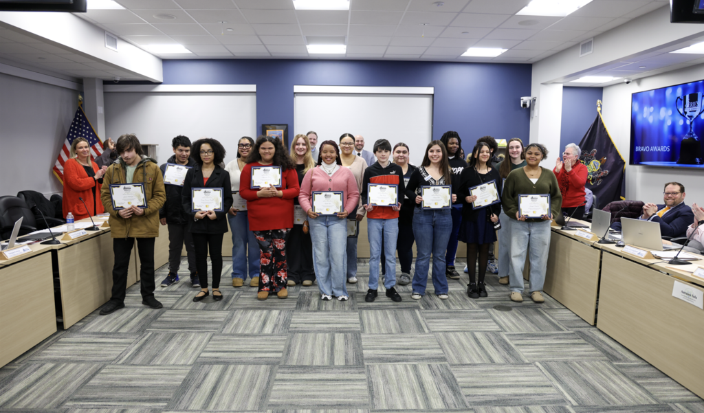 Group of students holding their certificates.