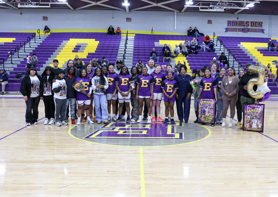 A group of people including the Erie High School Royals Basketball girls.