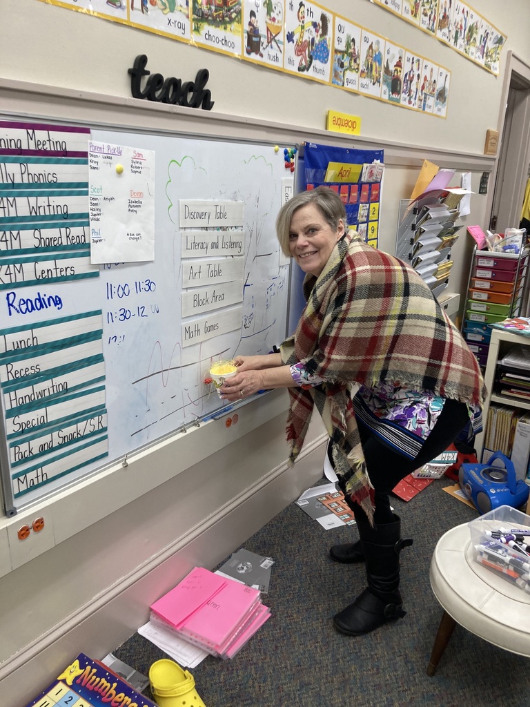 The peeps writing on the board in kindergarten.