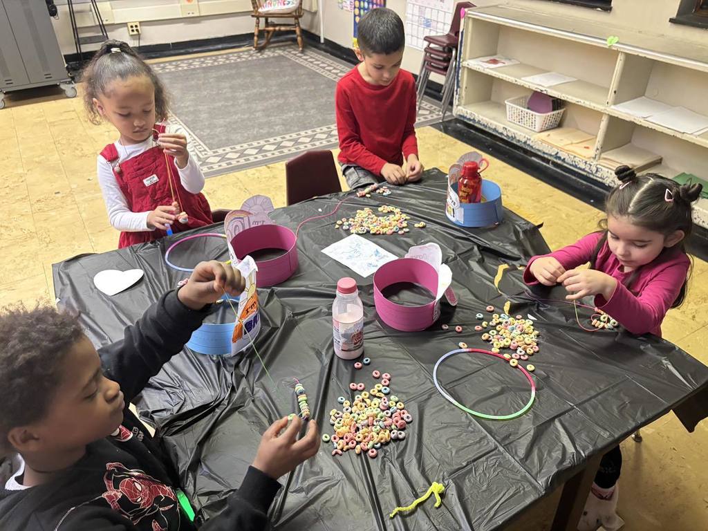 Kids doing a craft in class. 