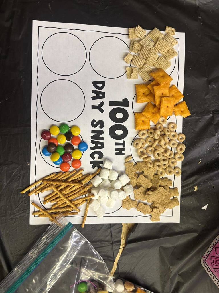 Different snacks on a piece of paper that says 100th day snack. 