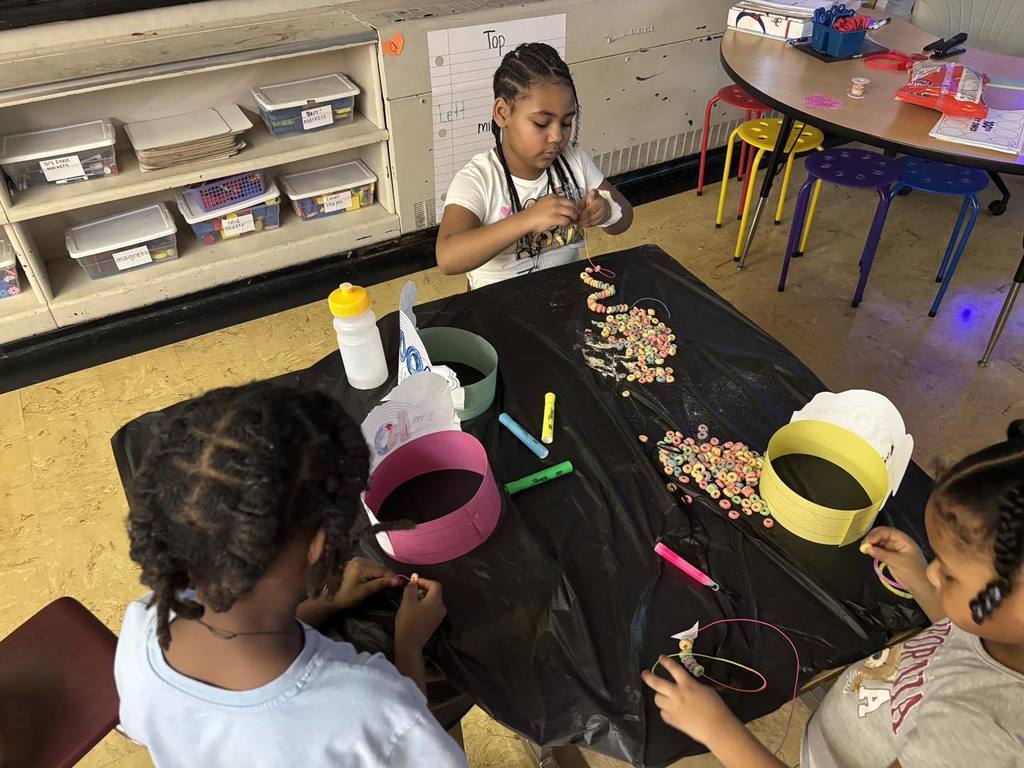 Kids doing a craft in class. 