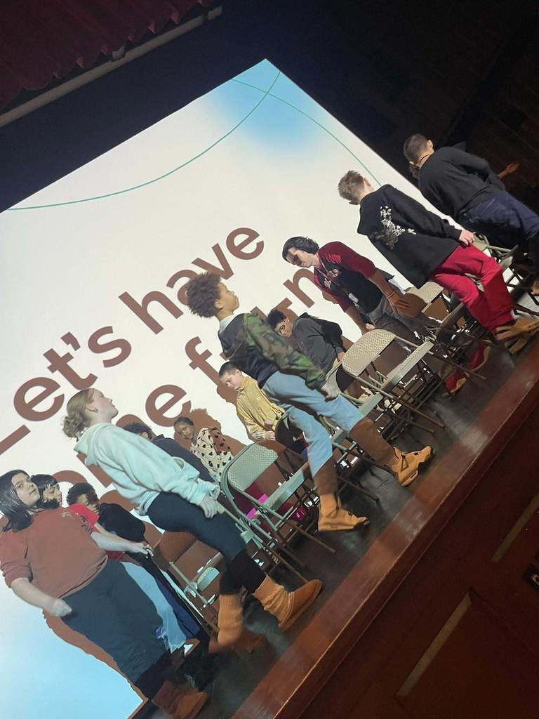 Students walking on stage. 