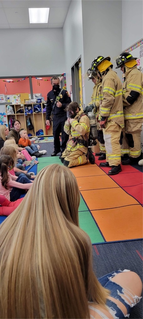 preschool students with fire fighters