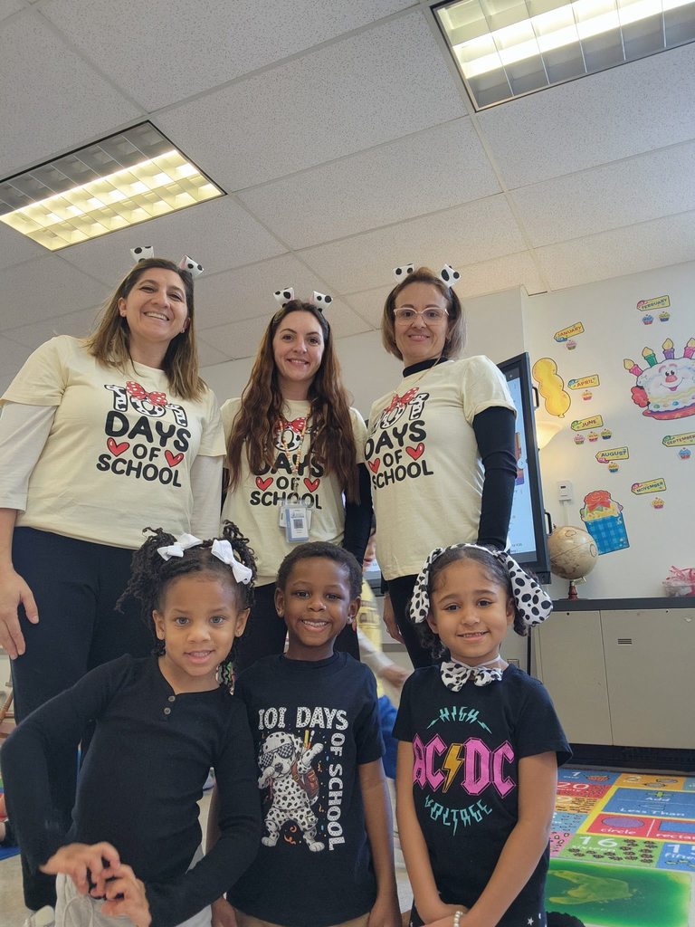 A teachers and students wearing shirts that recognize that it is the 101 day of school. 