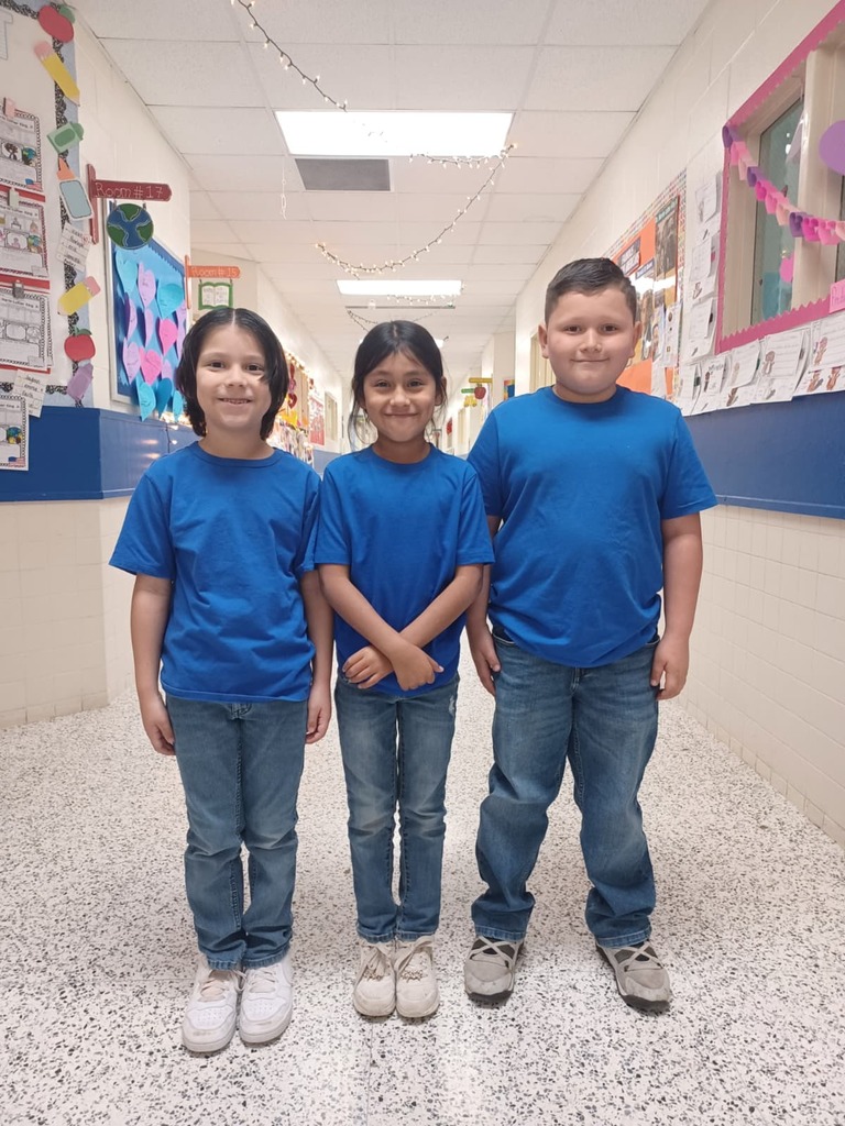Students with school uniform royal blue top and blue jeans