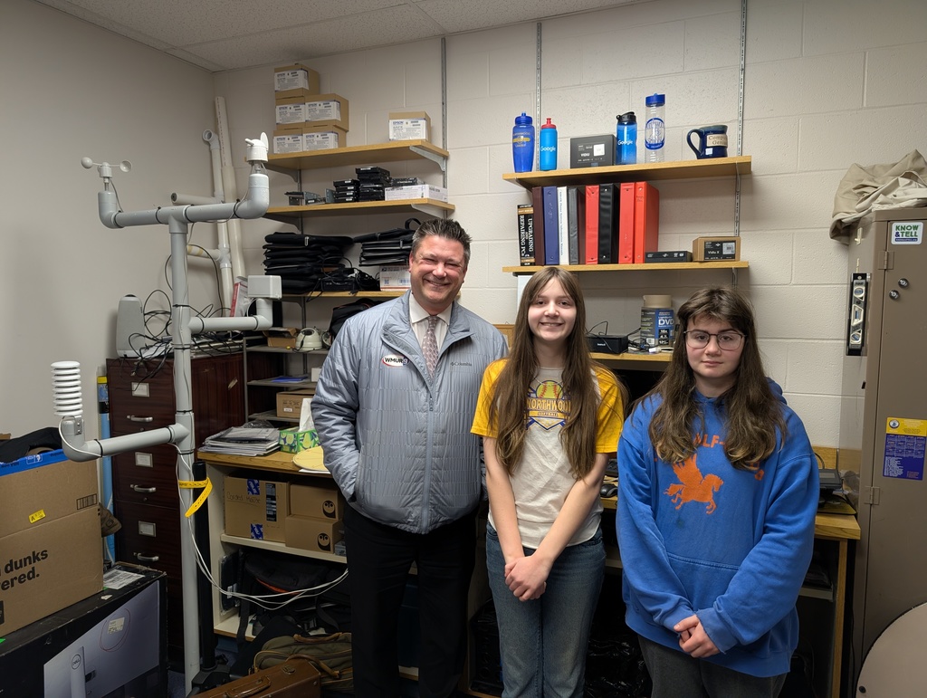 Kevi Skarupa and our STEM kids in front of the weather station