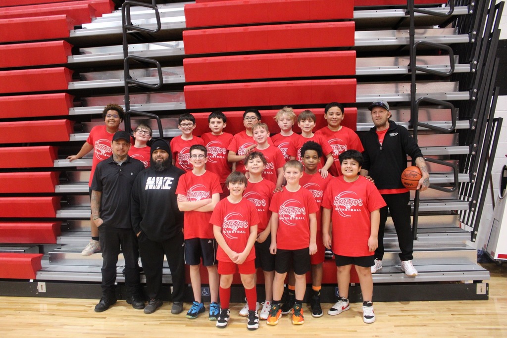 Group basketball picture in red shirts.