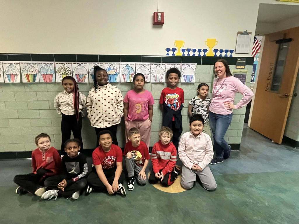 Students and teacher dressed in pink and red. 
