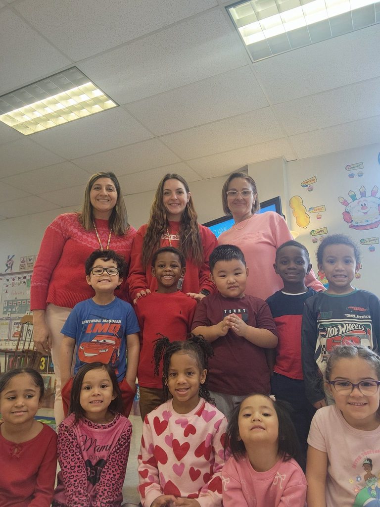 Students and teachers dressed in pink and red. 
