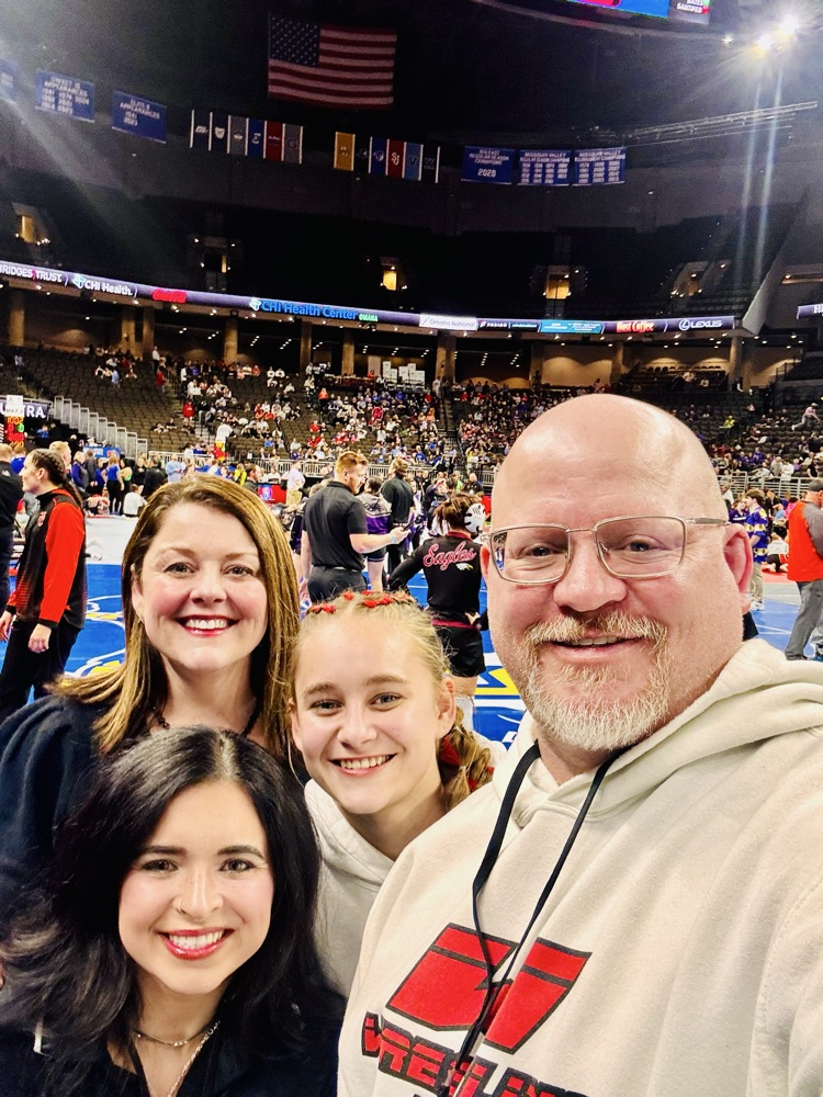 Coach Mickala Sjulin, Capri Hansen, Coach Addie Strong and Coach Jeremy Strong- on the mats before Round 1