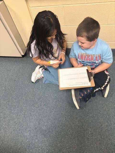 Two students working on a class assignment together.