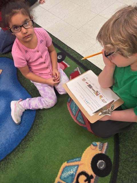 Two students working on a class assignment together.