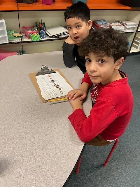 Two students working on a class assignment together.