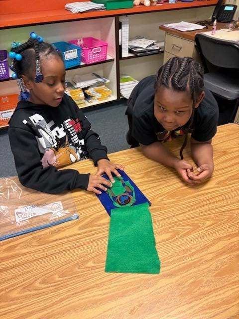 Two students working on a class assignment together.