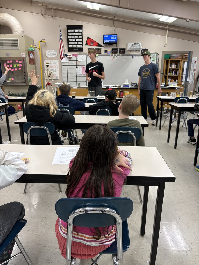 HS students teaching 4th grade chemistry lesson