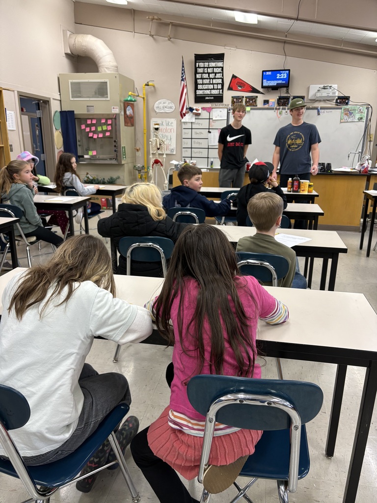 HS students teaching 4th grade chemistry lesson