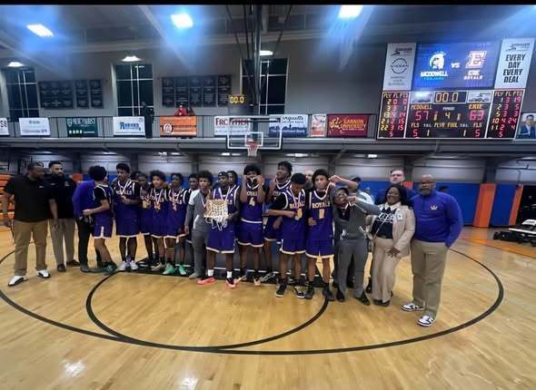 Erie High Royals Team photo with Dr. Gibbs and other adults.