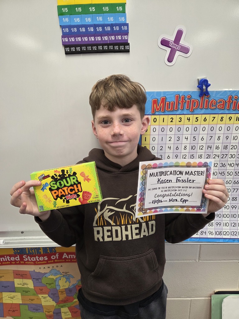 Kasen smiling with his multiplication certificate!