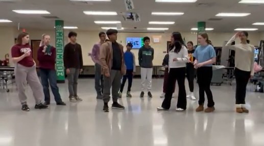 Students rehearsing in the school cafeteria