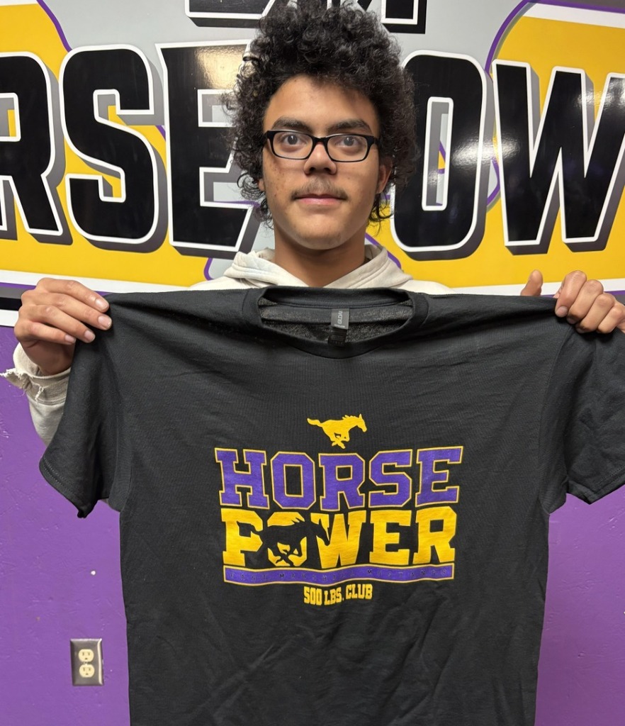 James H. holding a Horse Power shirt