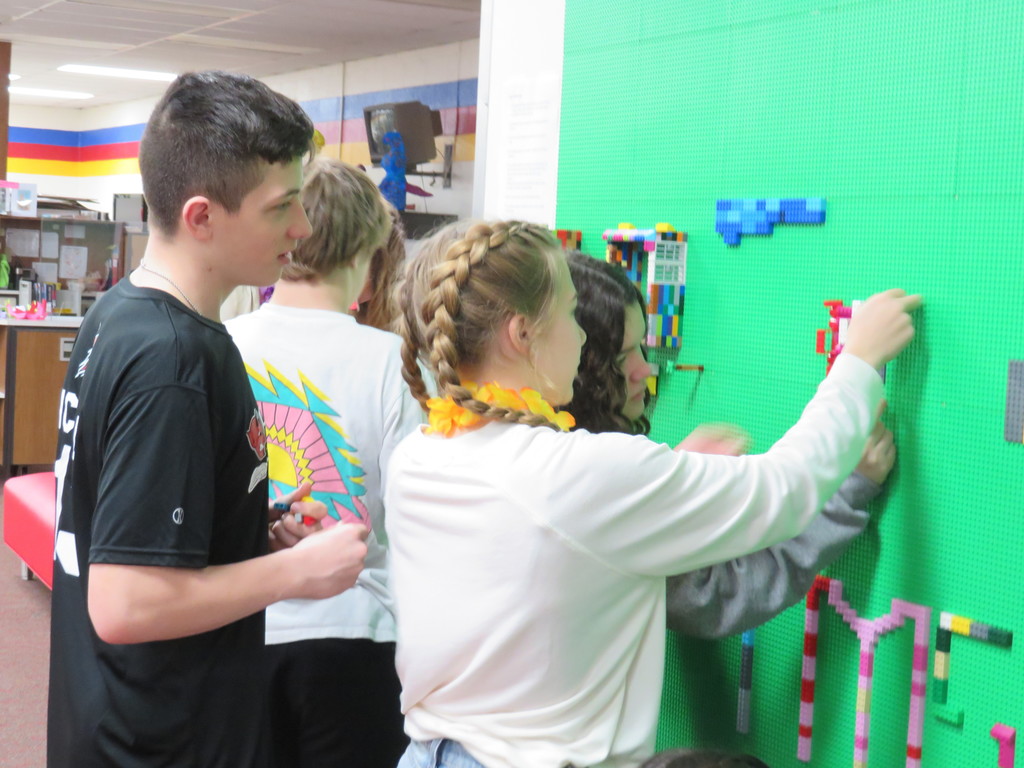 Students create at the Lego Wall.