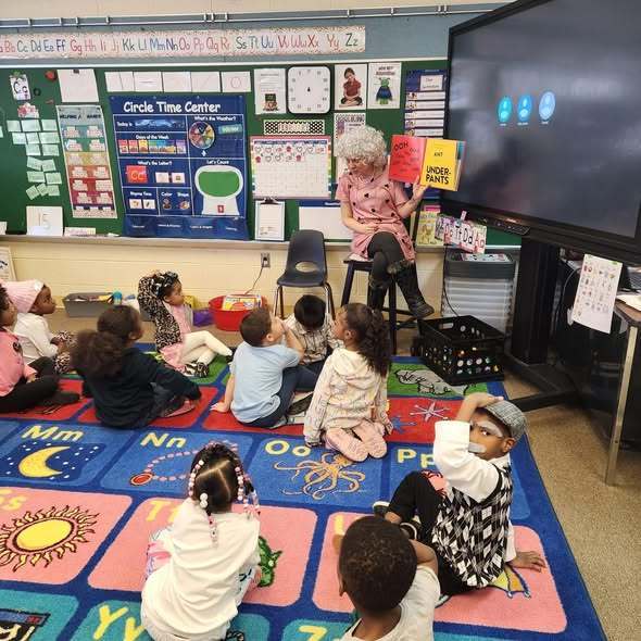 A teacher reading to her students.