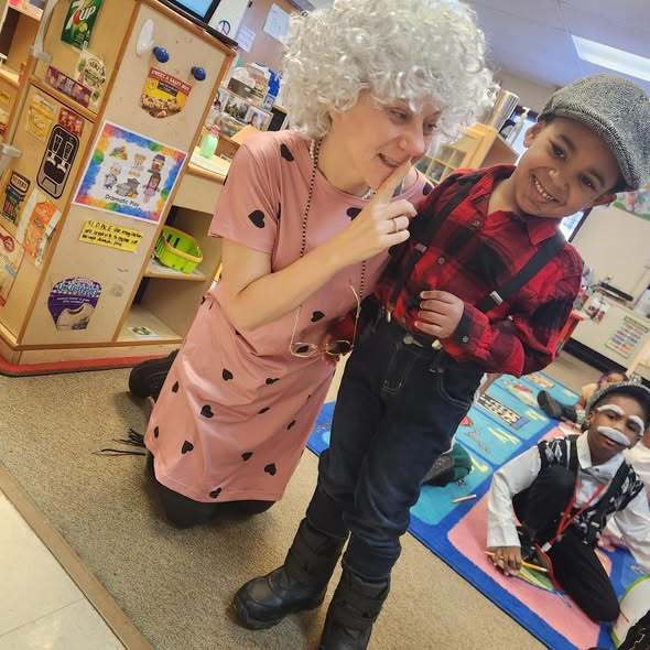 A teacher and student dressed as old people.