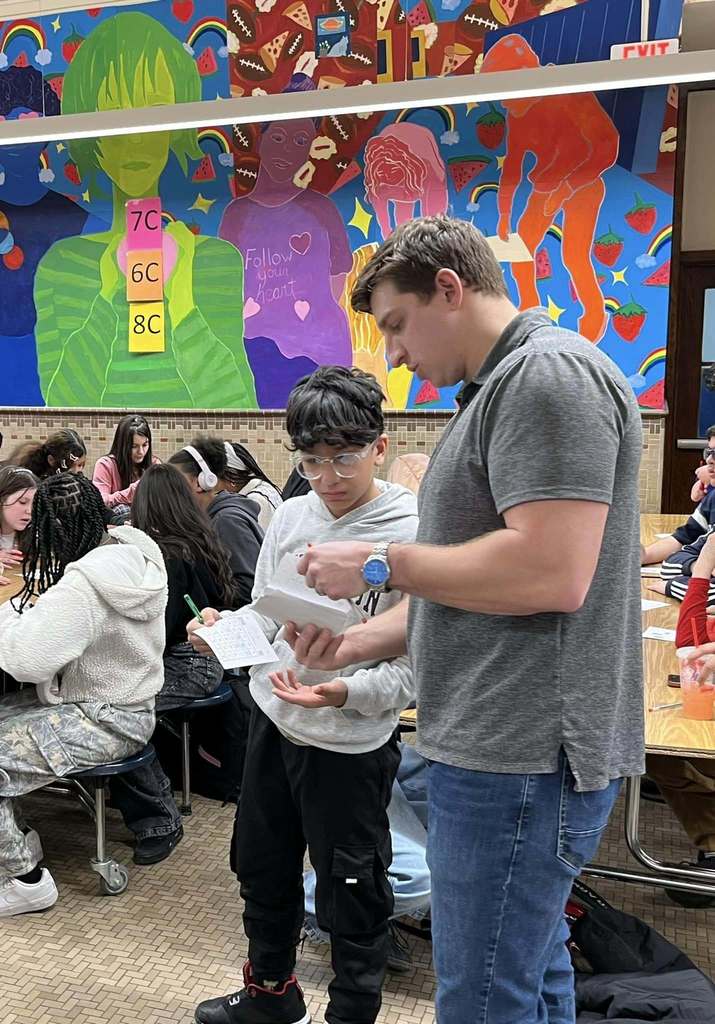 A teacher helping a student.