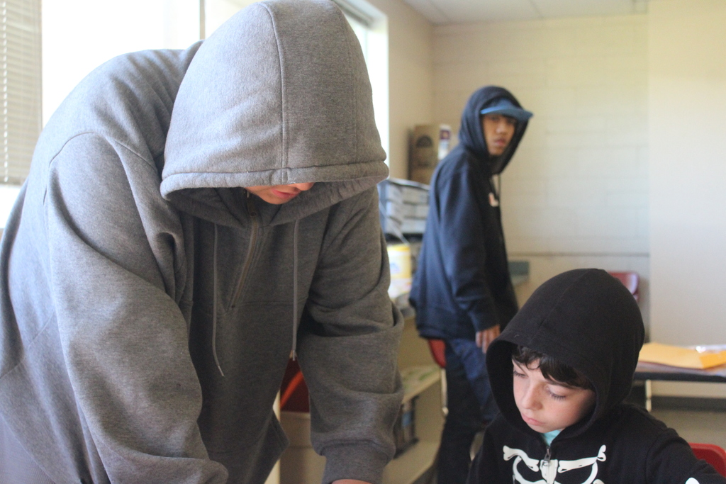 High school students working with 2nd grade students to build airplanes! 