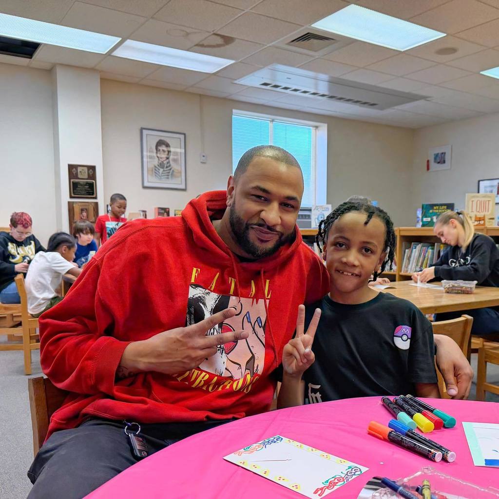 A father and son smiling.