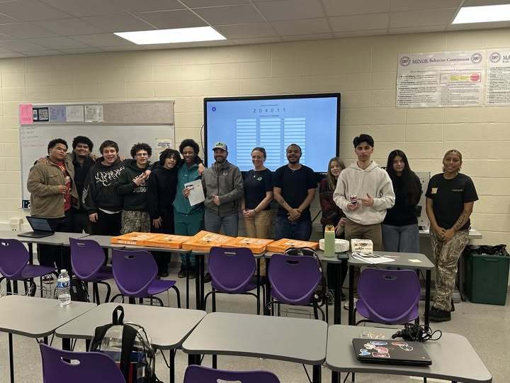 A photo of students and representatives from Harrell Automotive.