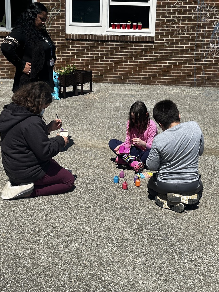 students painting outside