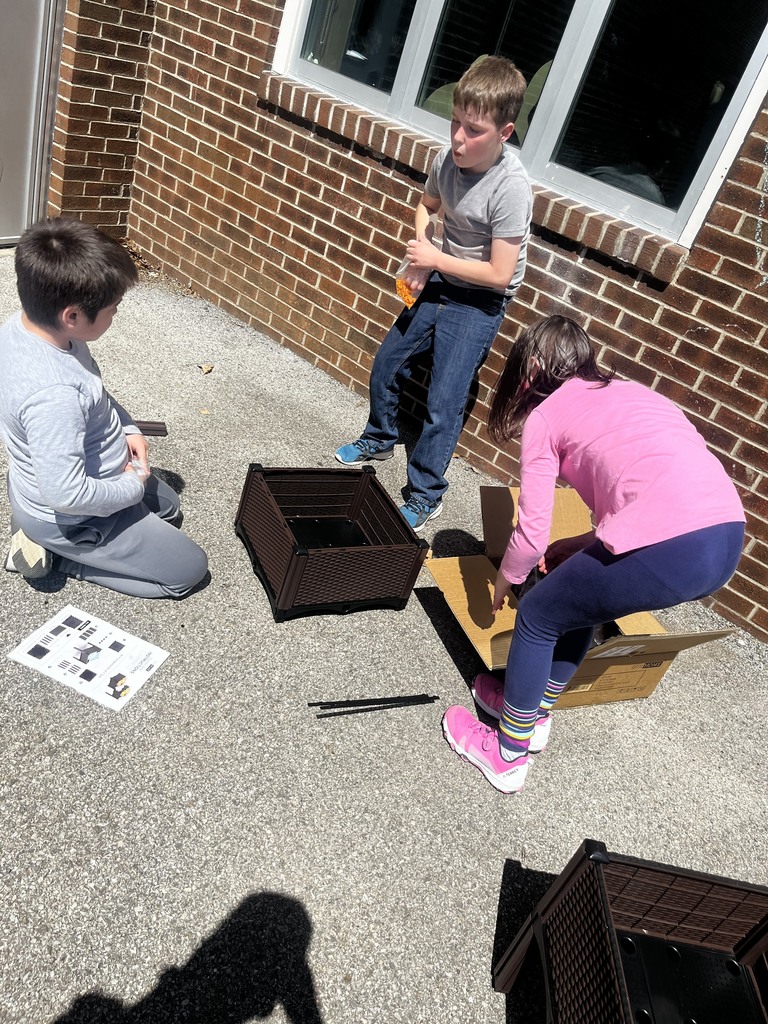 students planting outside