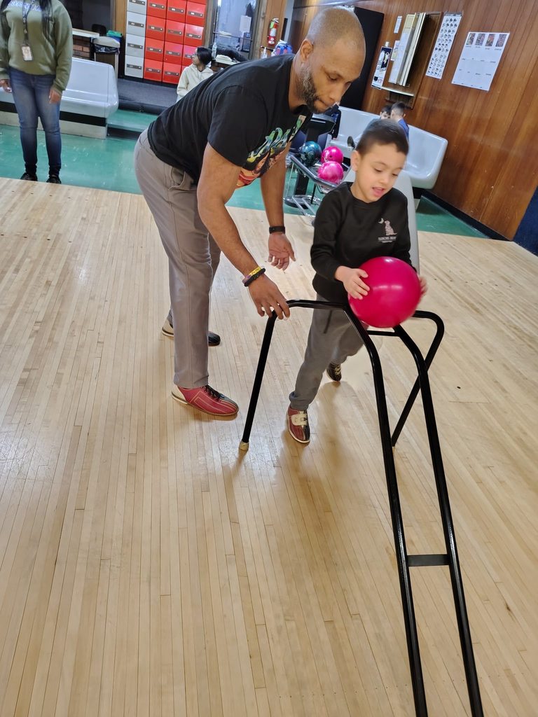 A child bowling. 